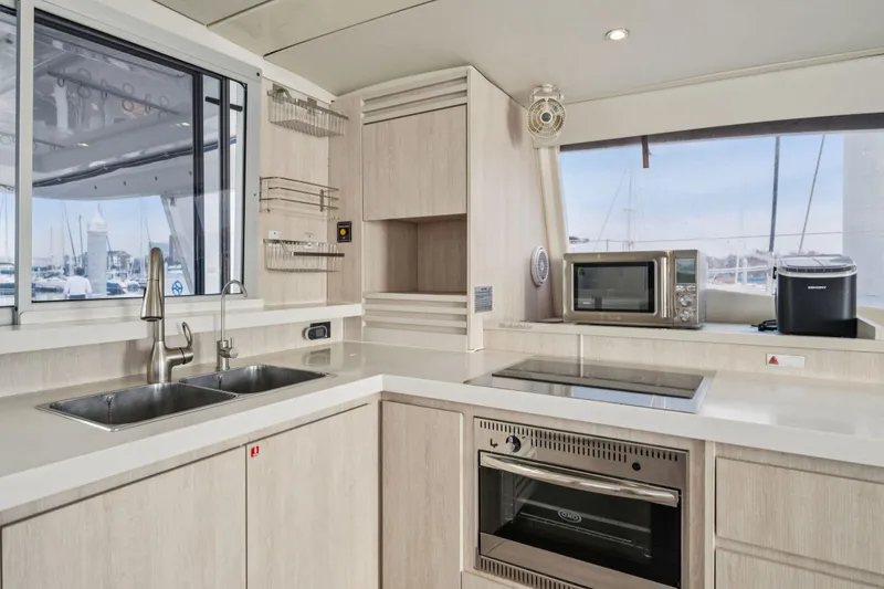 Slide: The Image of Modern kitchen interior on 2016 Leopard 48 yacht with appliances and sleek design. - 101