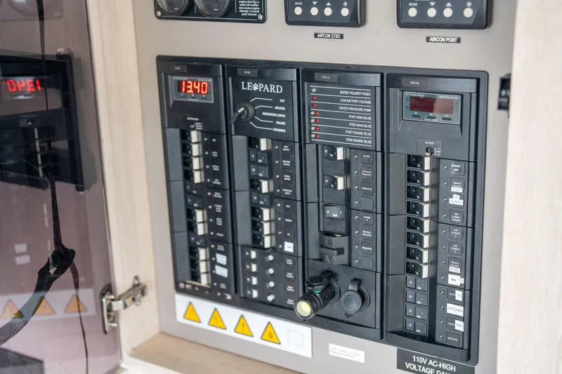 Slide: The Image of Electrical control panel of a 2016 Leopard 48 yacht, featuring various switches and indicators. - 108