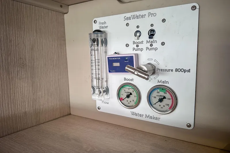Slide: The Image of Control panel of a 2016 Leopard 48 yacht water maker system with gauges and switches. - 110
