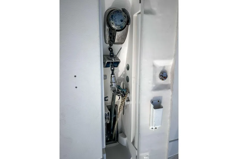 Slide: The Image of Anchor storage compartment on a 2016 Leopard 48 yacht, featuring chain and rope. - 111