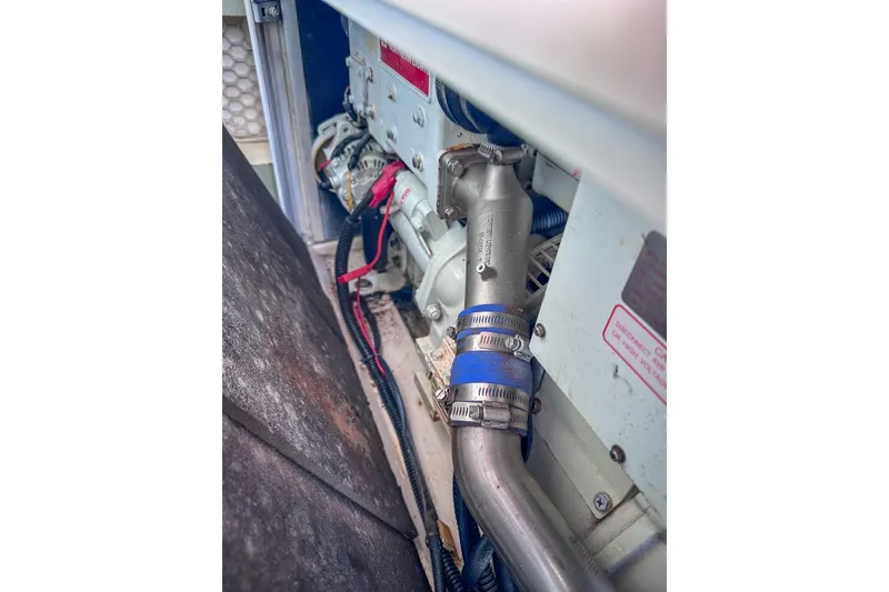 Slide: The Image of Engine compartment of a 2016 Leopard 48 yacht, showing pipes and wiring. - 113