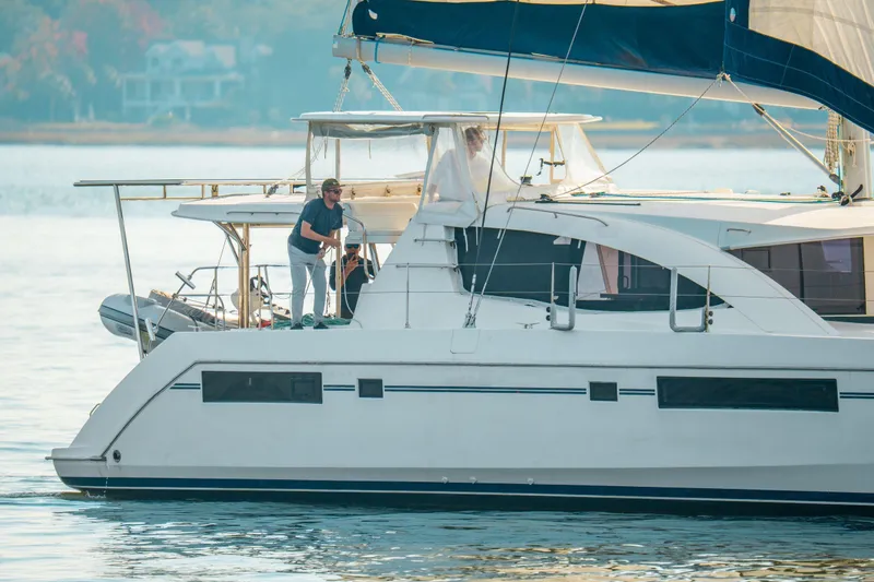 Slide: The Image of 2016 Leopard 48 yacht sailing with people on deck in calm waters. - 117