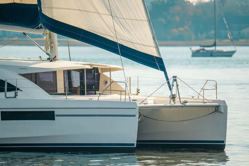 Slide: The Image of 2016 Leopard 48 catamaran sailing on calm waters with sails up. - 118