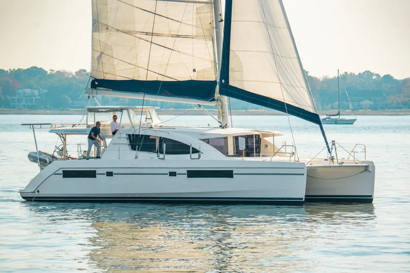 Slide: The Image of 2016 Leopard 48 catamaran sailing on calm waters with crew onboard. - 119