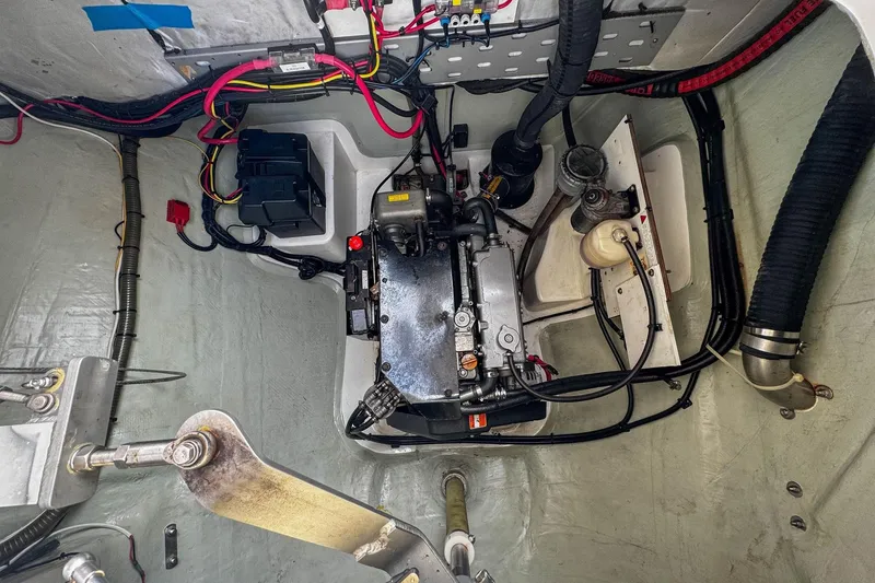 Slide: The Image of Engine compartment of a 2016 Leopard 48 yacht, showcasing wiring and mechanical components. - 120