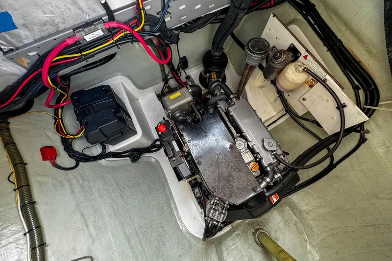 Slide: The Image of Engine room of a 2016 Leopard 48 yacht, featuring wiring and mechanical components. - 121
