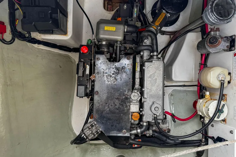 Slide: The Image of Engine compartment of a 2016 Leopard 48 yacht, showcasing mechanical components and wiring. - 123