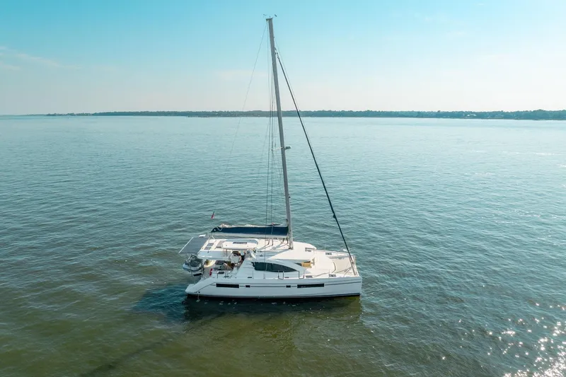 Slide: The Image of 2016 Leopard 48 catamaran sailing on calm waters under a clear blue sky. - 19