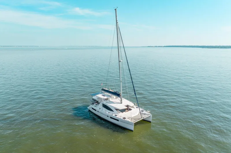 Slide: The Image of 2016 Leopard 48 catamaran sailing on calm blue waters under a clear sky. - 20