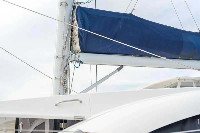 Slide: The Image of Sailboat mast and boom with blue sail cover on 2016 Leopard 48 yacht. - 25