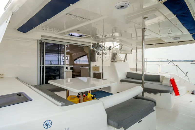 Slide: The Image of Luxurious 2016 Leopard 48 yacht interior with spacious seating and dining area. - 31