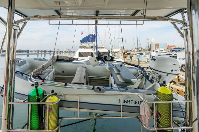 Slide: The Image of 2016 Leopard 48 yacht with dinghy and scuba tanks at marina. - 37