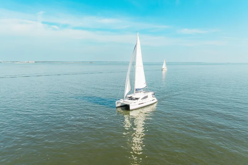 Slide: The Image of Sailing catamaran Leopard 48, 2016 model, cruising on calm blue waters under clear skies. - 4