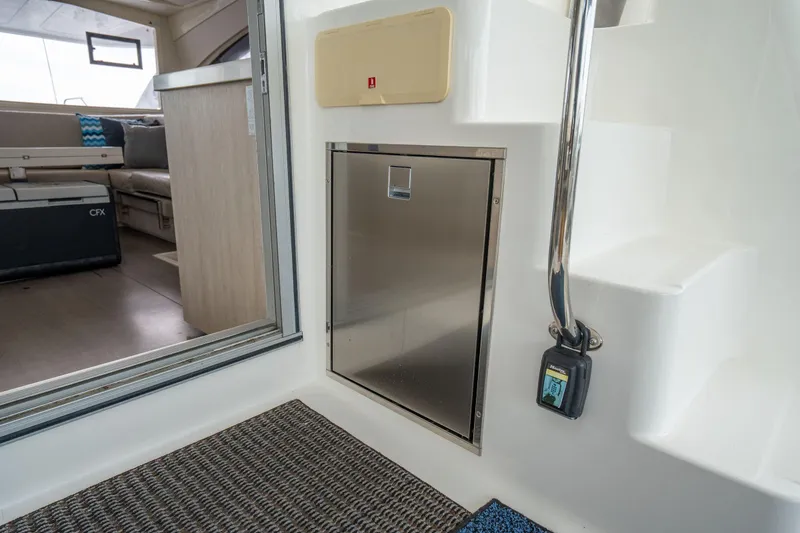 Slide: The Image of Interior of 2016 Leopard 48 yacht, featuring stainless steel door and modern seating area. - 40