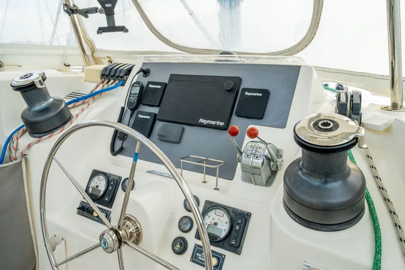 Slide: The Image of Helm of 2016 Leopard 48 yacht with navigation instruments and steering wheel. - 43