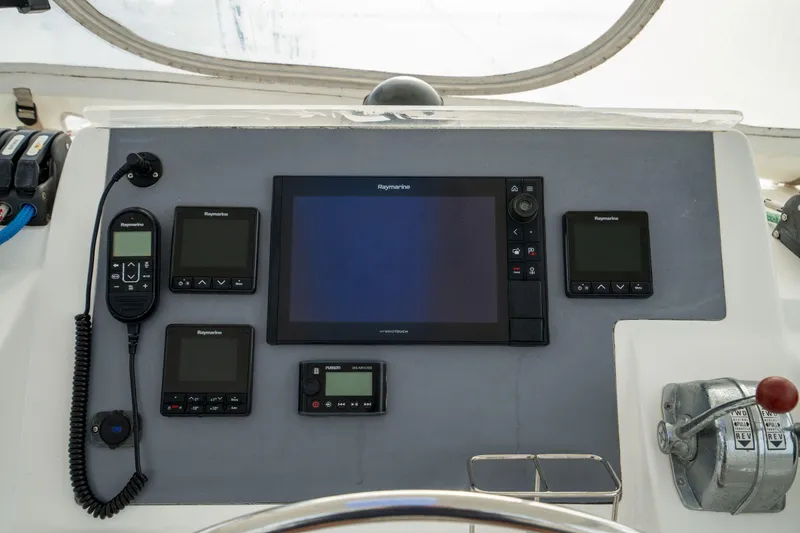 Slide: The Image of Control panel of a 2016 Leopard 48 yacht with Raymarine navigation equipment. - 49