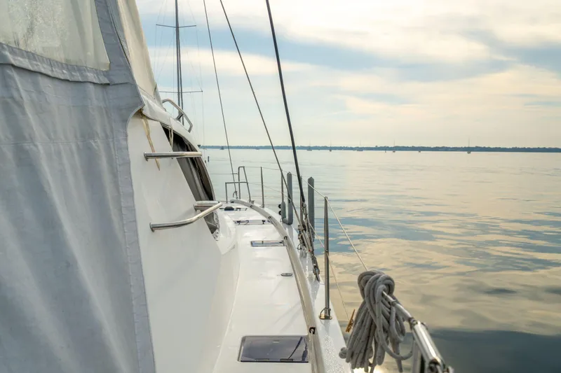 Slide: The Image of Sailing on a 2016 Leopard 48 yacht, calm waters, serene sky. - 52