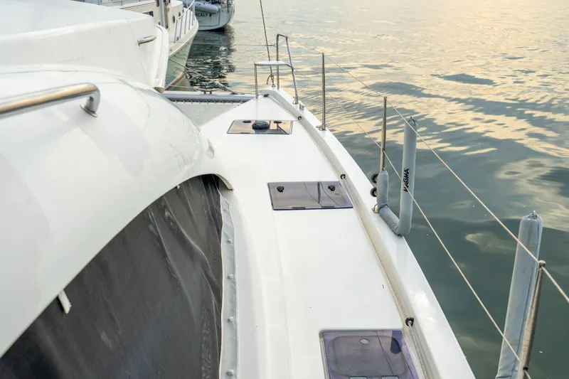 Slide: The Image of Leopard 48 yacht deck, 2016 model, docked by calm waters at sunset. - 53
