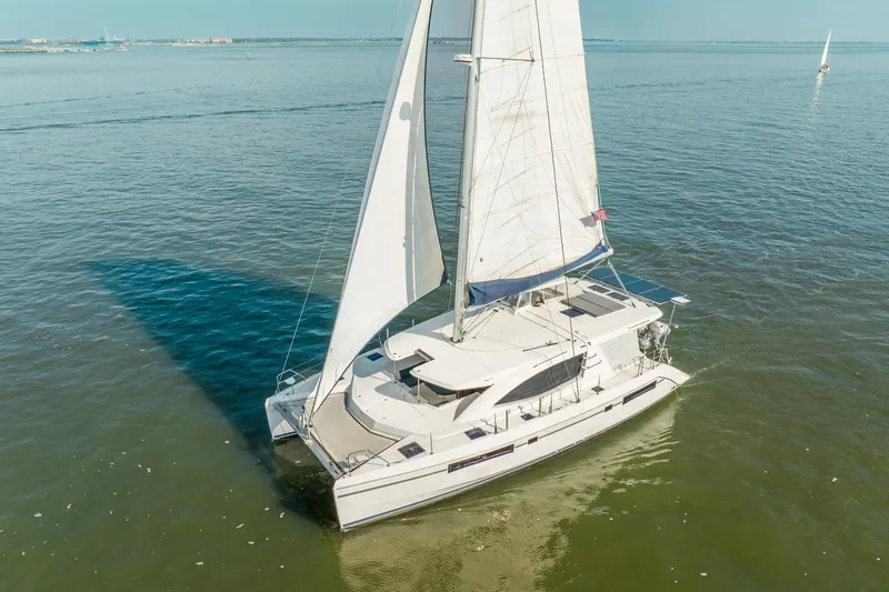 Slide: The Image of 2016 Leopard 48 catamaran sailing on calm waters under clear skies. - 6