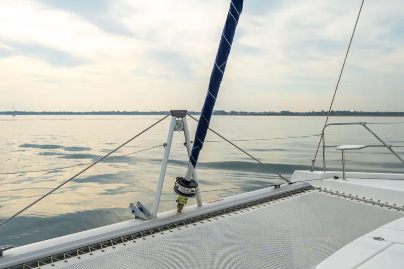 Slide: The Image of Sailing on a 2016 Leopard 48 catamaran, calm waters, and serene sky. - 62
