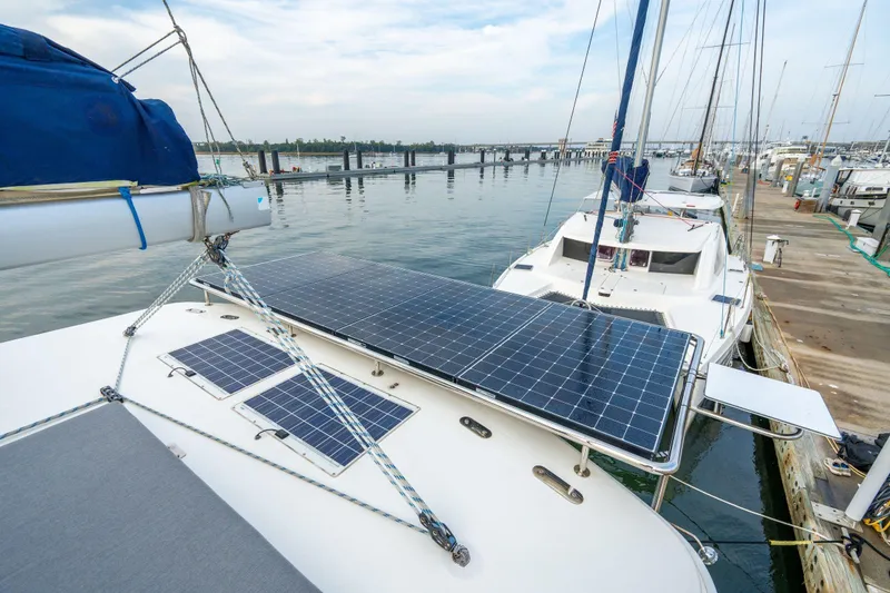 Slide: The Image of 2016 Leopard 48 yacht with solar panels docked at marina. - 67