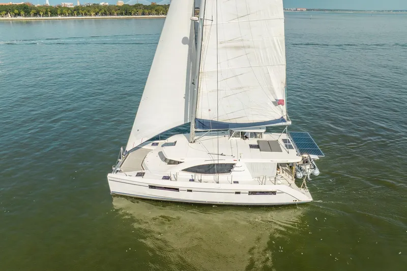 Slide: The Image of 2016 Leopard 48 sailboat cruising on calm waters with full sails. - 7