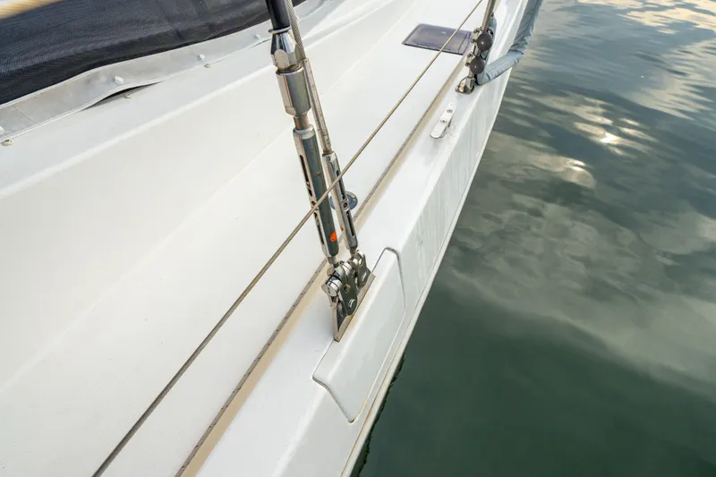 Slide: The Image of Close-up of a 2016 Leopard 48 sailboat deck and railing over water. - 75