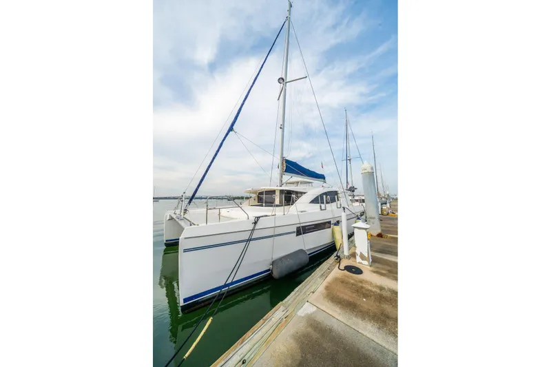 Slide: The Image of 2016 Leopard 48 catamaran docked at marina under clear sky. - 76