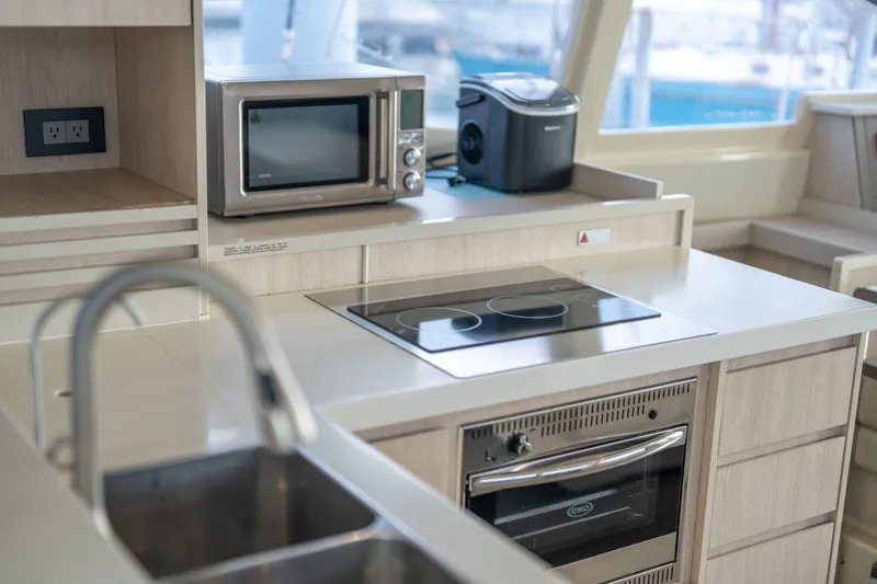 Slide: The Image of Modern kitchen in 2016 Leopard 48 yacht with appliances and sleek design. - 77