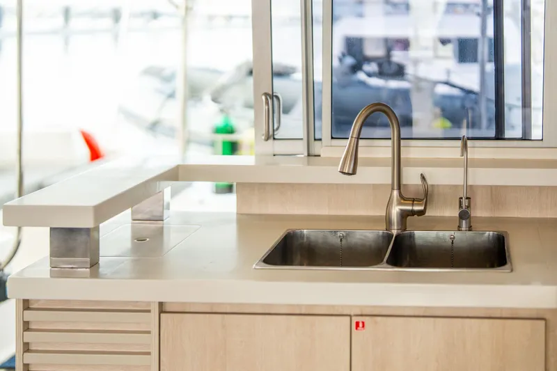 Slide: The Image of Modern kitchen sink on 2016 Leopard 48 yacht with stainless steel fixtures. - 78