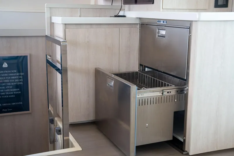 Slide: The Image of Modern kitchen drawer in 2016 Leopard 48 yacht, featuring sleek stainless steel design. - 79