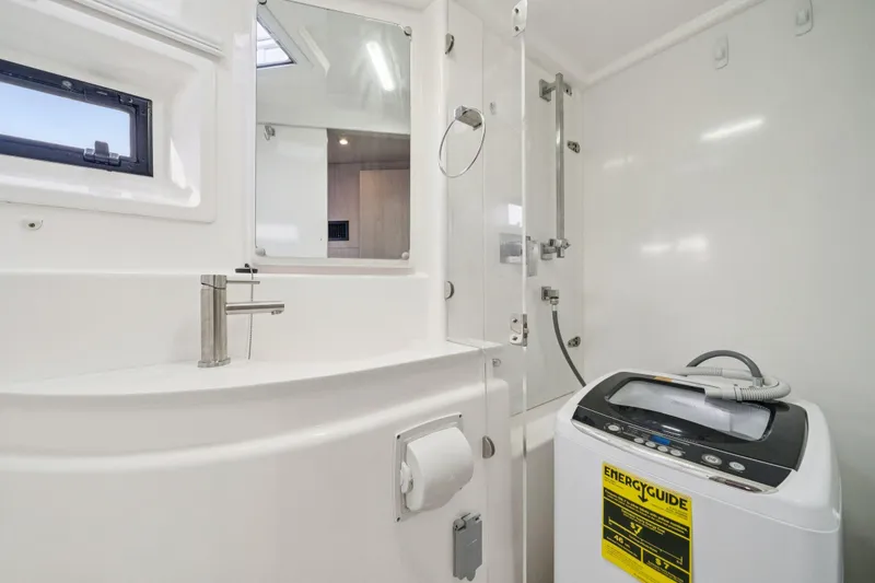 Slide: The Image of Modern bathroom in 2016 Leopard 48 yacht with washing machine and shower. - 82