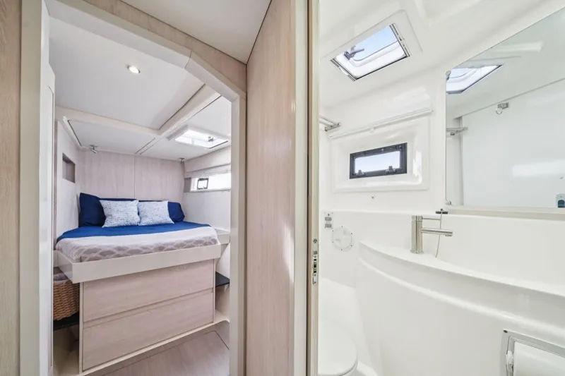 Slide: The Image of Luxurious interior of 2016 Leopard 48 yacht featuring bedroom and bathroom. - 83