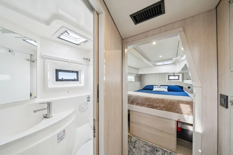 Slide: The Image of Luxurious interior of 2016 Leopard 48 yacht featuring bedroom and bathroom. - 84