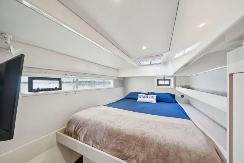 Slide: The Image of Luxurious bedroom interior of 2016 Leopard 48 yacht with modern design and cozy bedding. - 86