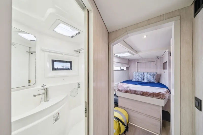 Slide: The Image of Luxurious interior of 2016 Leopard 48 yacht featuring a cozy bedroom and modern bathroom. - 87
