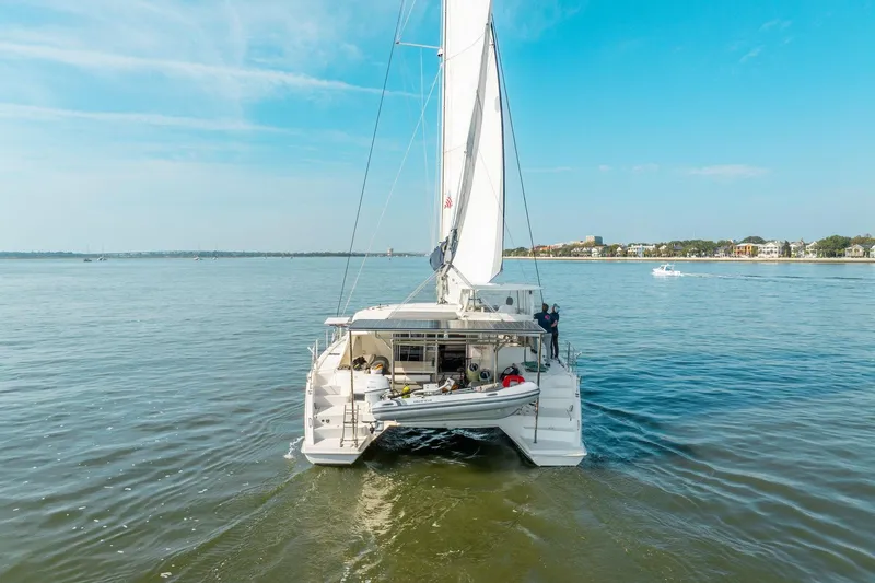 Slide: The Image of 2016 Leopard 48 catamaran sailing on calm waters under a clear blue sky. - 9