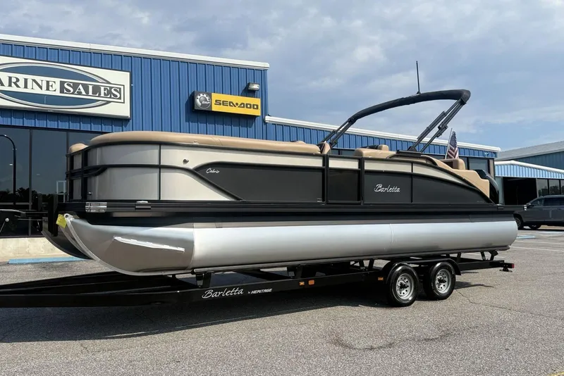 Slide: The Image of 2025 Barletta Cabrio 24U pontoon boat on trailer at Marine Sales dealership. - 3