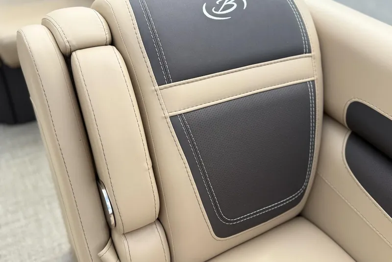 Slide: The Image of 2025 Barletta Cabrio 24U boat seat, beige and black leather upholstery, close-up view. - 8