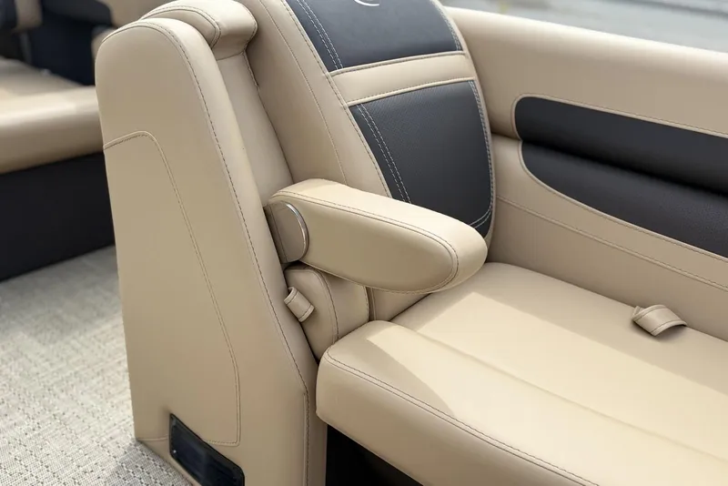Slide: The Image of Luxurious seating in 2025 Barletta Cabrio 24U boat, featuring beige and black upholstery. - 9