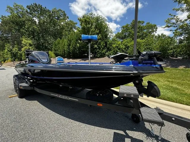 Slide: The Image of 2024 Vexus VXS20 boat on trailer, parked outdoors, featuring Garmin equipment. - 3
