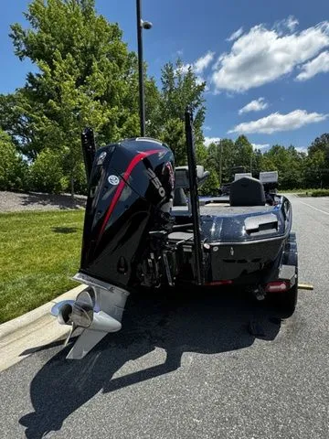 Slide: The Image of 2024 Vexus VXS20 boat with powerful outboard motor, parked on a sunny day. - 4