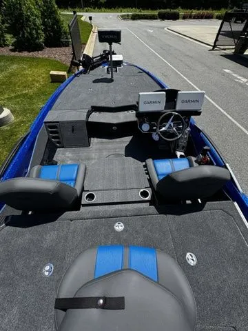 Slide: The Image of 2024 Vexus VXS20 boat interior with dual Garmin displays and blue-accented seating. - 5