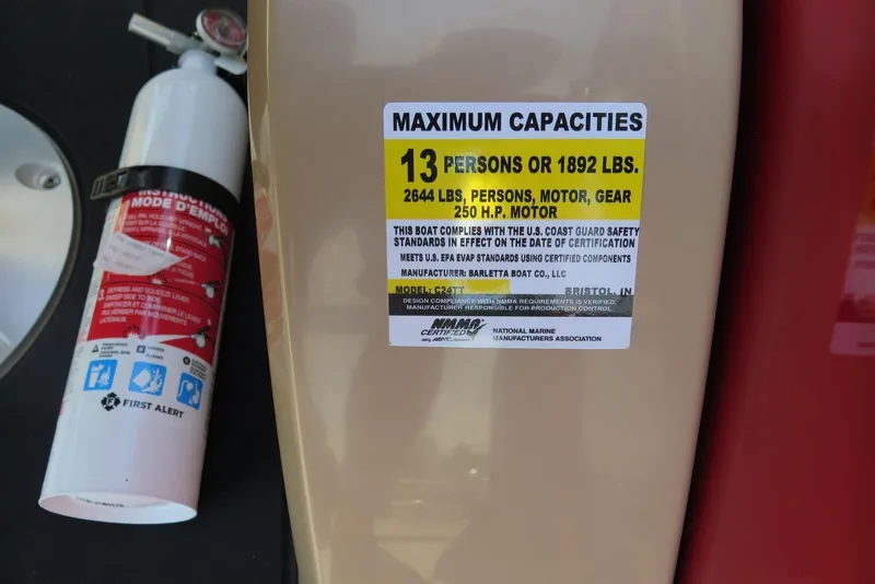 Slide: The Image of 2026 Barletta Cabrio 24UC capacity label, 13 persons or 1892 lbs, with fire extinguisher. - 16