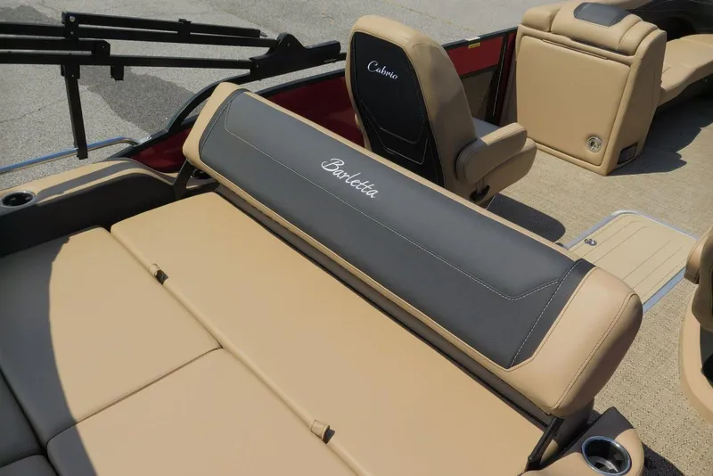 Slide: The Image of 2026 Barletta Cabrio 24UC boat interior with beige and gray seating. - 21