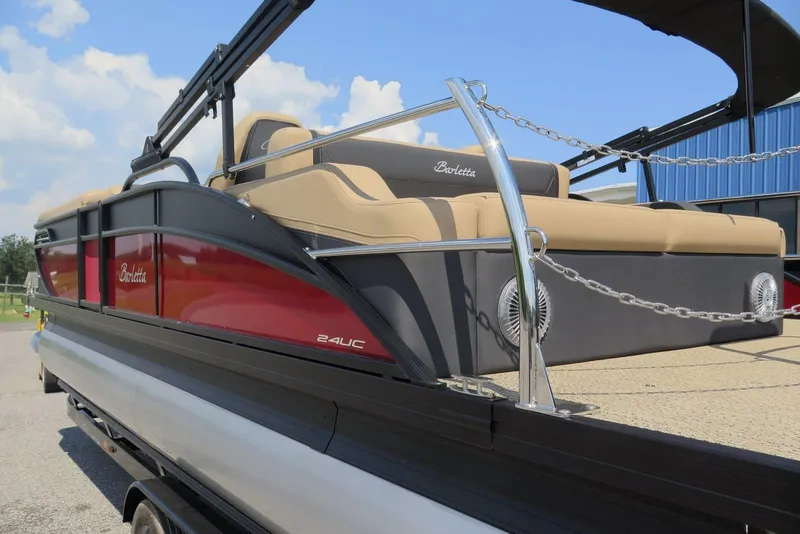 Slide: The Image of 2026 Barletta Cabrio 24UC pontoon boat with sleek design and luxurious seating. - 23