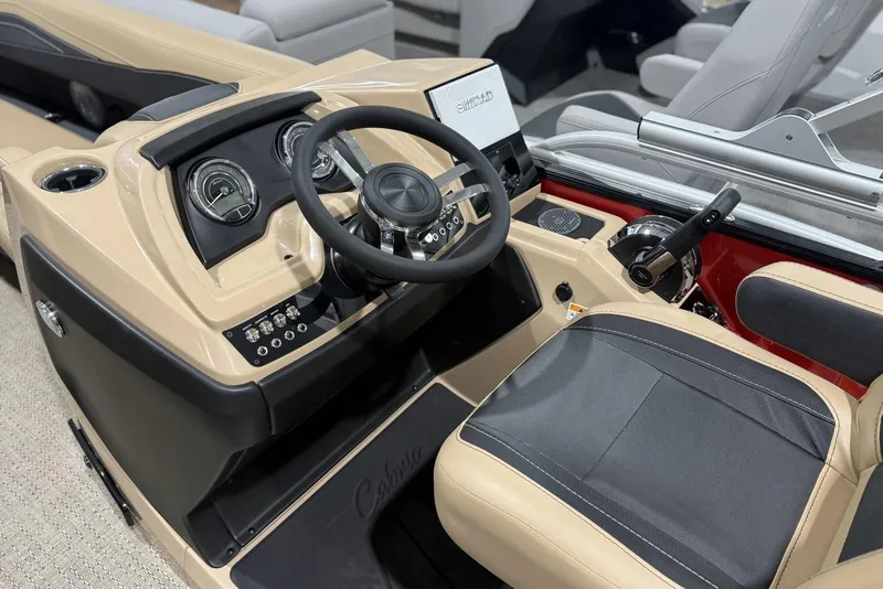 Slide: The Image of 2026 Barletta Cabrio 24UC boat interior with steering wheel and control panel. - 26