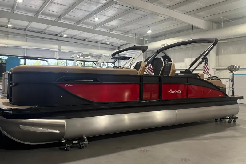 Slide: The Image of 2026 Barletta Cabrio 24UC pontoon boat in showroom, featuring sleek design and modern amenities. - 28
