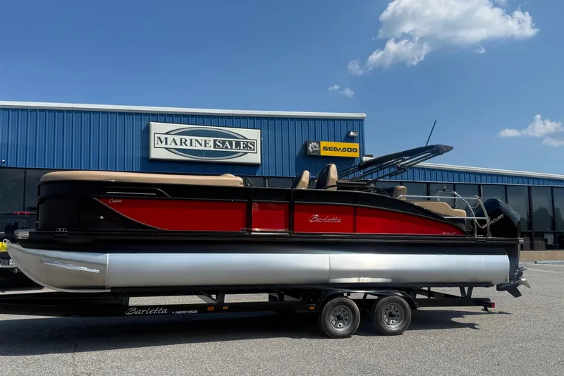 Slide: The Image of 2026 Barletta Cabrio 24UC pontoon boat displayed at Marine Sales dealership. - 29