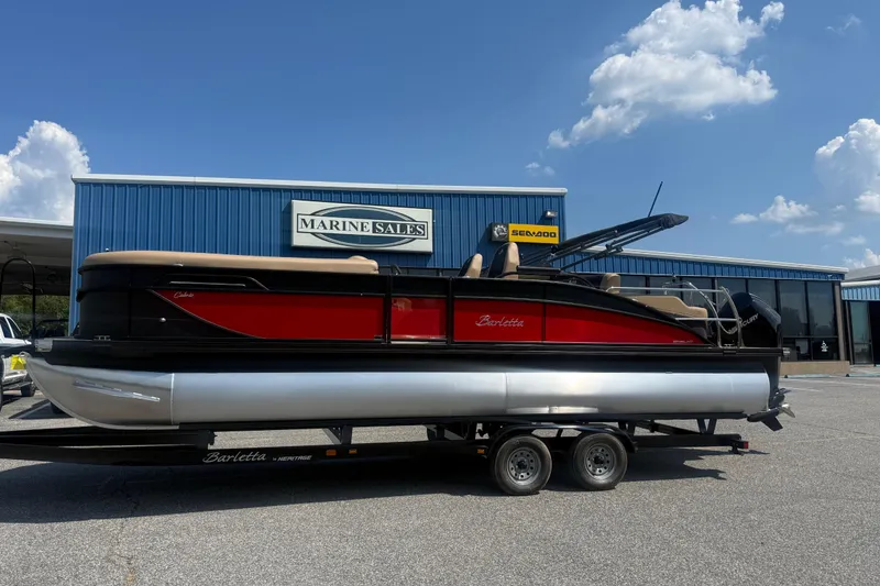 Slide: The Image of 2026 Barletta Cabrio 24UC pontoon boat on trailer at Marine Sales dealership. - 31